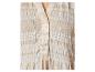 Detail van een beige blouse met wit geometrisch patroon en knopen.