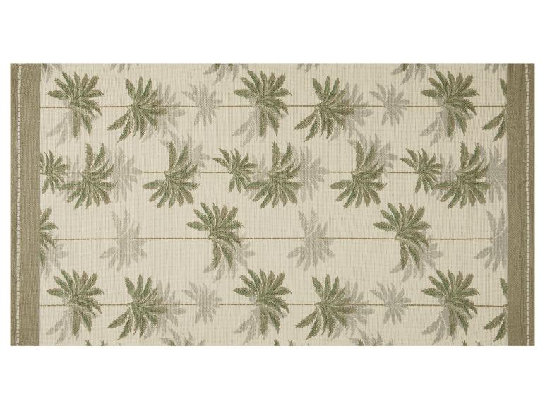 Beige vloerkleed met palmbladpatroon en bruine randen.