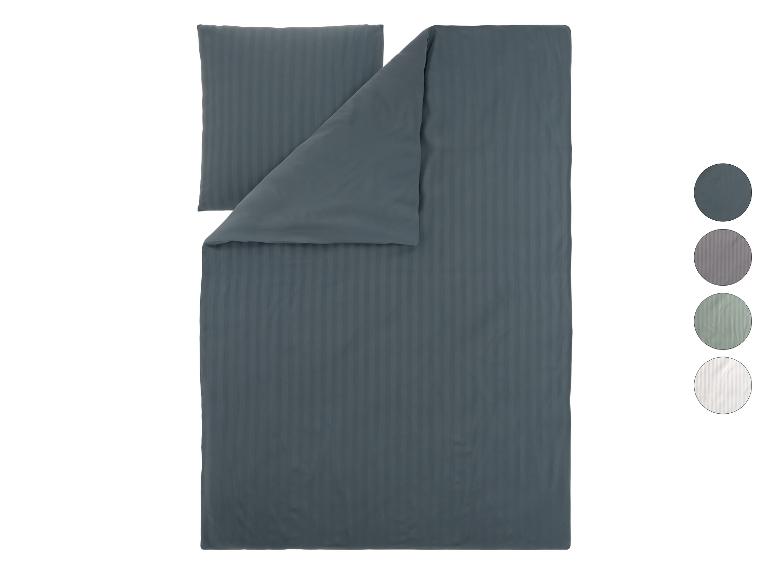 Donkergrijs gestreept dekbedovertrekset met kussen en kleurstalen.