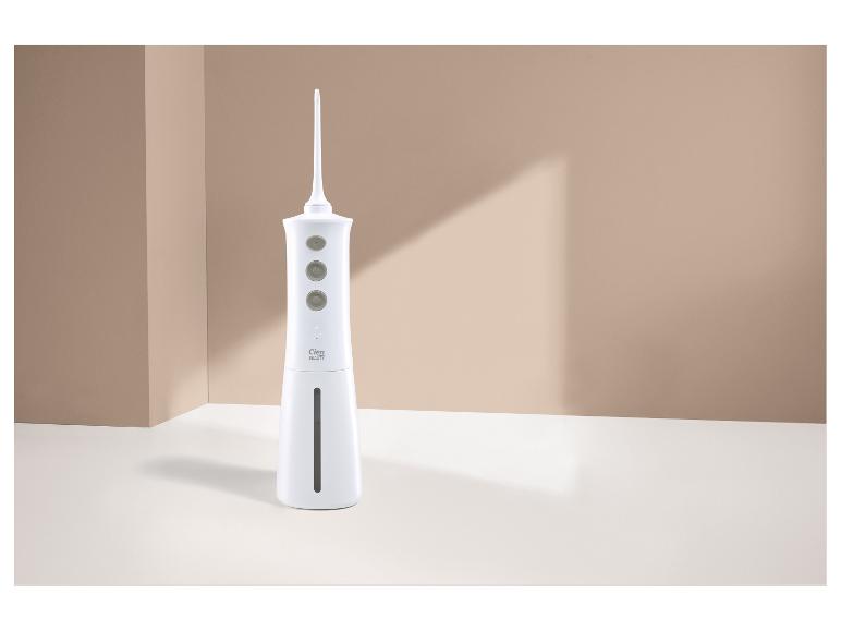 Witte monddouche met drie knoppen en waterniveau-indicator, staand op een witte achtergrond.