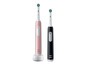 Twee Oral-B Braun elektrische tandenborstels met oplaadstations.