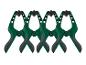 Vier groene en zwarte veerklemmen met Parkside-merk.