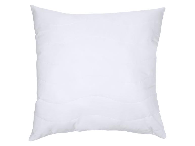 Wit kussen met golvende stiksels