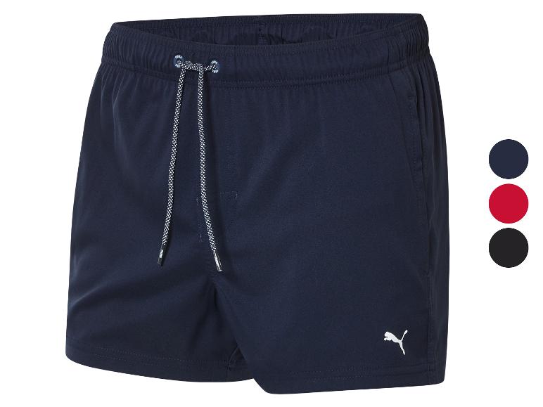 Puma zwemshorts: donkerblauw, rood en zwart.
