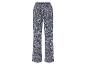 Donkerblauwe broek met witte bloemenprint.