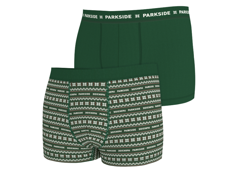 Twee groene herenboxershorts, waarvan één met een feestelijk patroon.