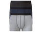 Drie paar boxershorts in grijs, donkerblauw en zwart.