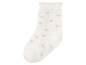 Witte sok met roze hartjes