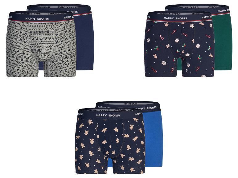 Drie tweepacks herenboxershorts met kerstthema-patronen.