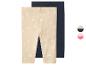 2-pack baby meisjesleggings: één beige met madeliefjes en één effen marineblauw.