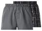 Twee boxershorts, één grijze en één zwart geruite.