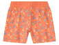 Oranje korte broek met een print van slippers en palmbomen.