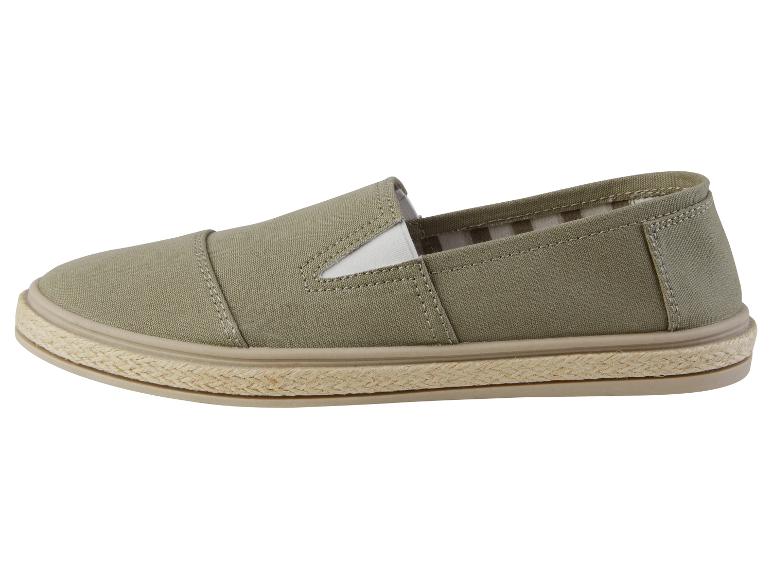 Beige canvas slip-ons met touwzool.