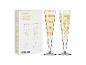 Twee champagneglazen met gouden muzieknoten en hartpatronen, in een witte doos.