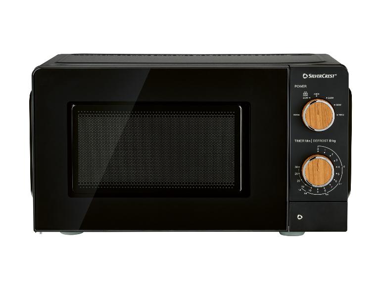 Zwarte magnetron met bedieningspaneel met twee houten draaiknoppen voor vermogen en tijd/ontdooien.