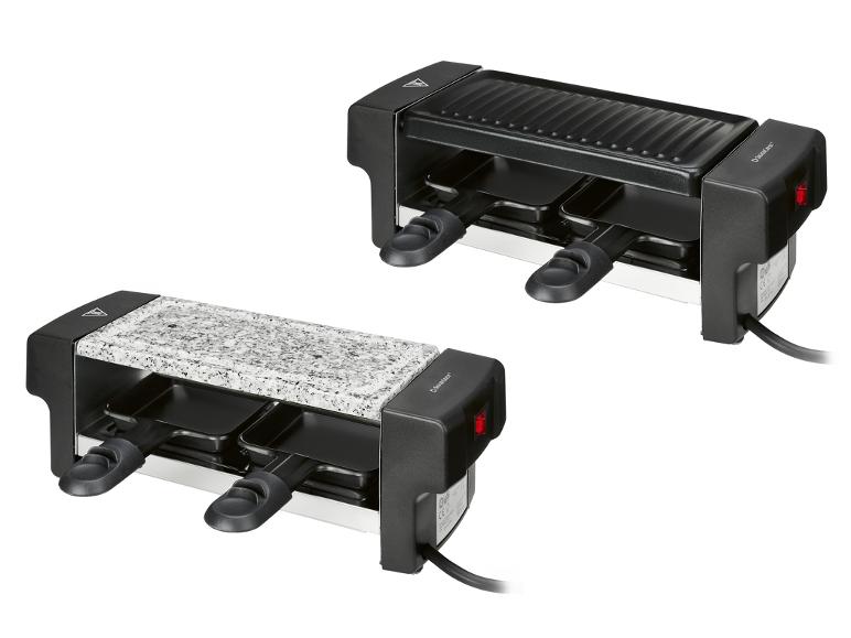 Twee SilverCrest raclette grills, één met geribbelde plaat en één met natuursteen.