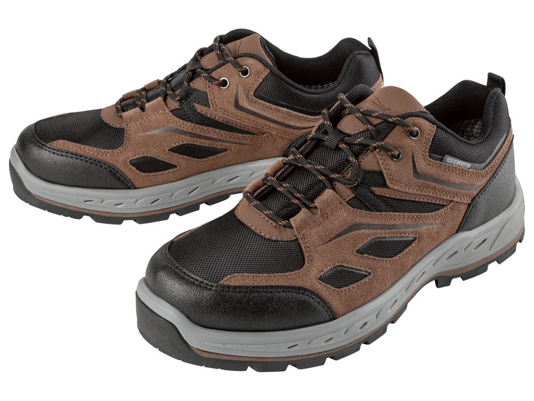 Twee paar bruine en zwarte wandelschoenen