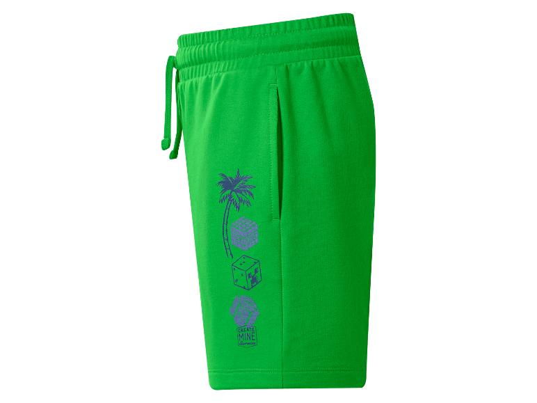 Groene shorts met een palmboom en gepixelde kubusafbeeldingen, met de tekst 'CREATE MINE Survive'