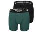 Twee paar boxershorts van het merk Mexx, een groene en een zwarte.