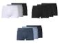 Drie verpakkingen herenboxershorts in wit, grijs, zwart en blauwtinten.