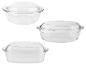 Drie transparante glazen ovenschalen met deksels, rond en rechthoekig.