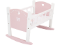 Roze en wit houten poppenwiegje met hart- en strikdecoraties.