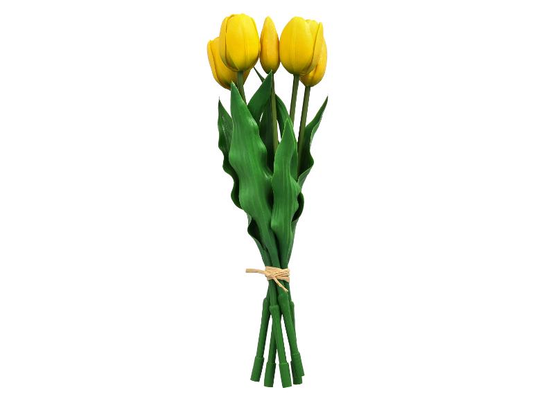 Boeket gele tulpen met groene bladeren, samengebonden met natuurlijk touw.