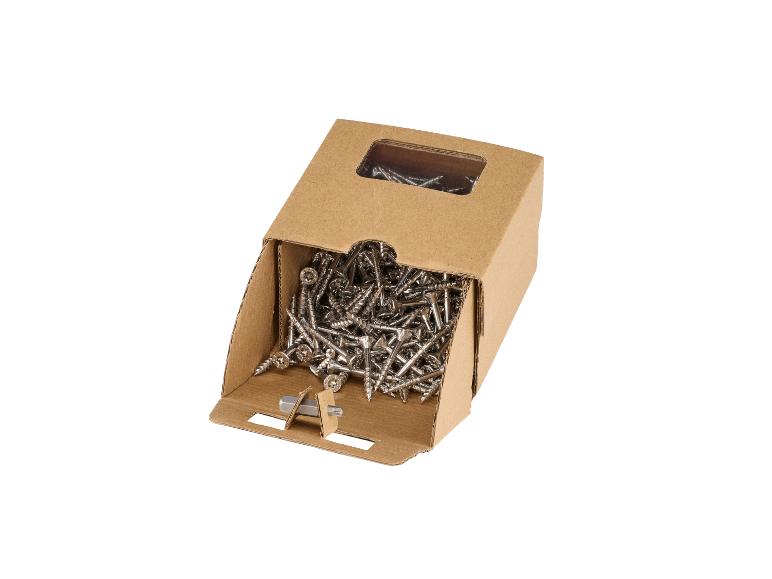Open kartonnen doos vol houtschroeven met een schroevendraaierbit.