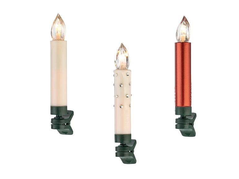 Drie elektrische kaarsen met clips, één wit, één versierd en één rood.