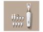 Manicure-/pedicureset met diverse opzetstukken op een beige achtergrond.