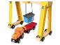 Een houten speelgoedset met een gele kraan, een oranje trein en een rode wagon.