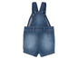 Een blauwe spijkerbroek overall voor baby's.