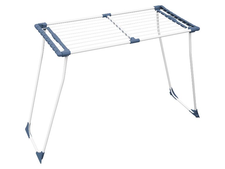 Wit wasrek met blauwe accenten, uitgeklapt.