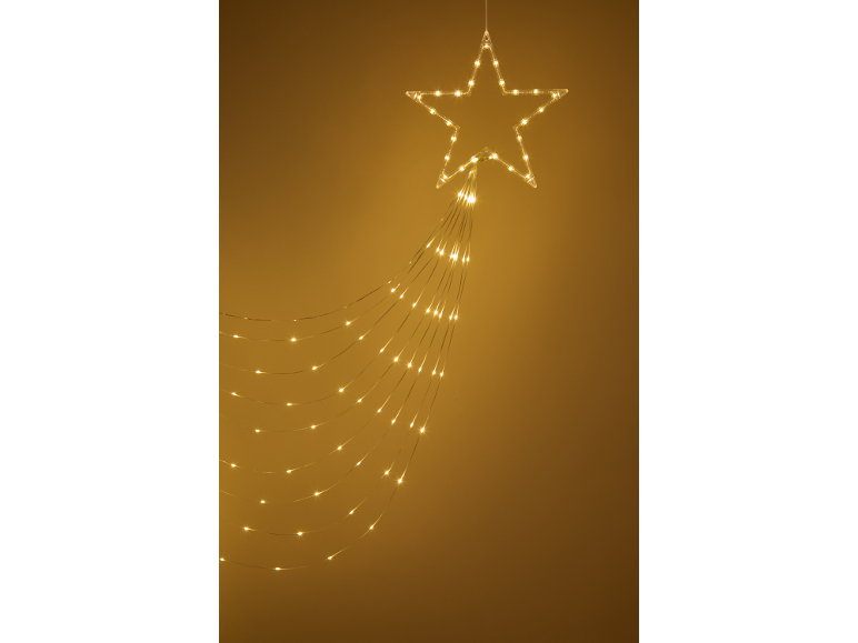 Stervormige LED-lichtslinger met cascadeverlichting op een gouden achtergrond.