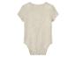 Beige baby romper van katoenen mousseline.