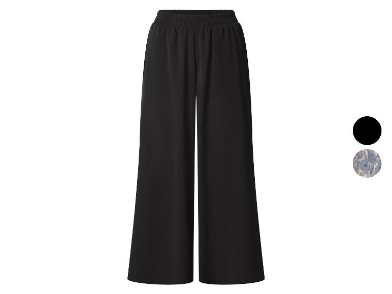 Zwarte wijde broek met elastische tailleband.