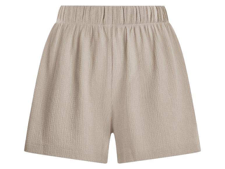 Lichtbeige gekreukelde shorts met elastische tailleband.