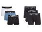 Zes Reebok boxershorts voor heren in wit, blauw en zwart.
