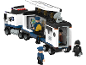 Speelgoed politietruck met minifiguren van politieagenten en een boef.