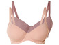 Twee beige bh's met brede bandjes.