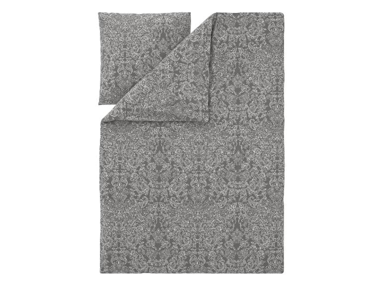 Grijs beddengoed met wit paisley patroon.