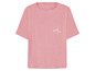 Roze T-shirt met de tekst 'smile'.