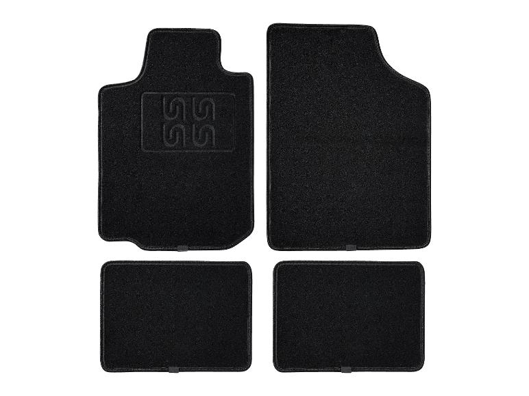 Vier zwarte automatten.