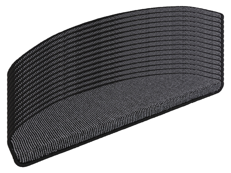 Een stapel zwarte en grijze deurmatten