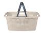 Beige wasmand met handgrepen en perforaties.