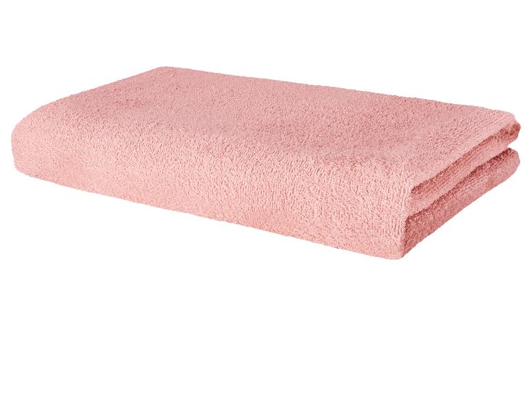 Gevouwen roze badhanddoek