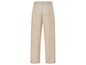 Beige broek met wijde pijpen.