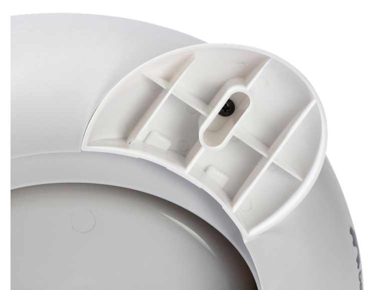Onderkant van een witte toiletverkleiner met een zichtbare zwarte schroef.