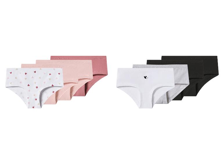 Multipack meisjesonderbroeken in roze, wit, grijs en zwart, sommige met hartjespatronen.