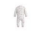 Witte baby romper met roze en blauwe bloemen en stippen.